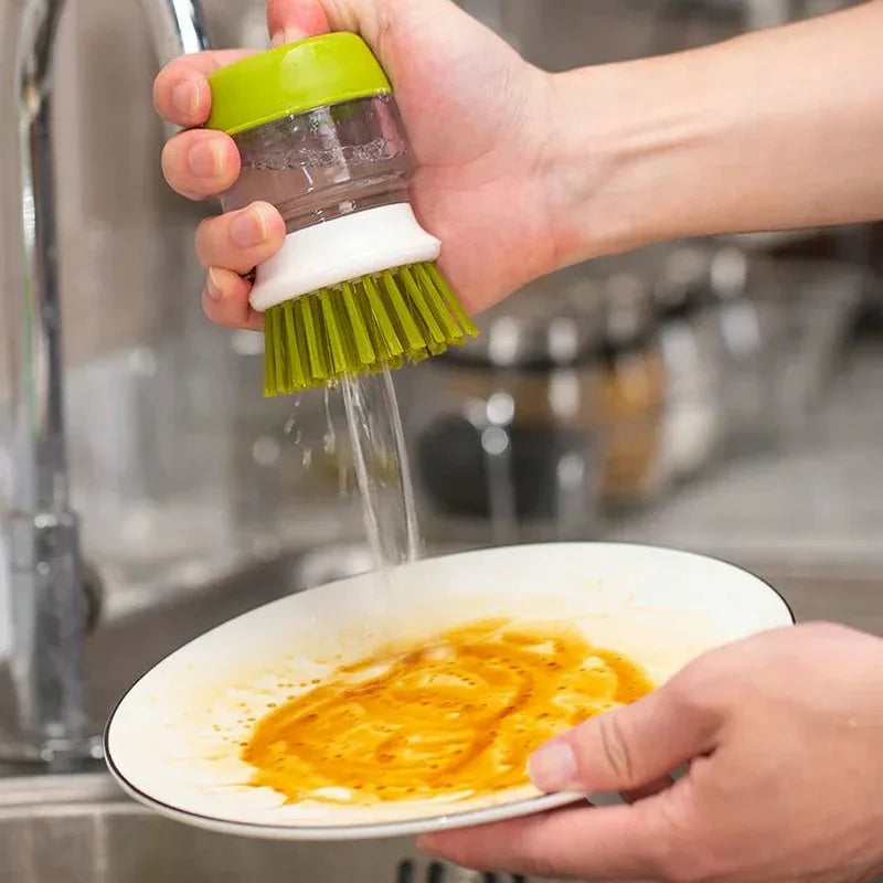 Brush with soap dispenser with holder
