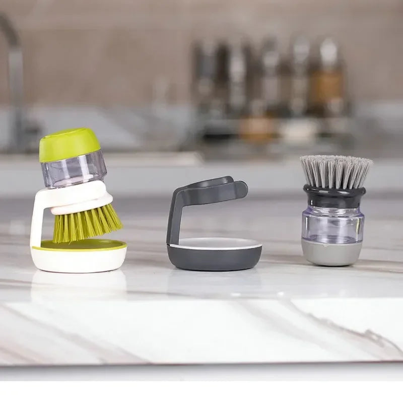 Brush with soap dispenser with holder
