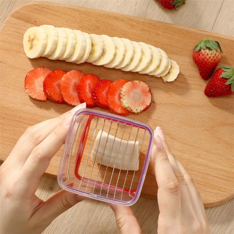 Fruit and vegetable cutter with push plate